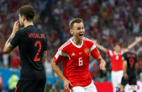 <p>Cheryshev celebrates after his wonder goal put Russia 1-0 up </p>