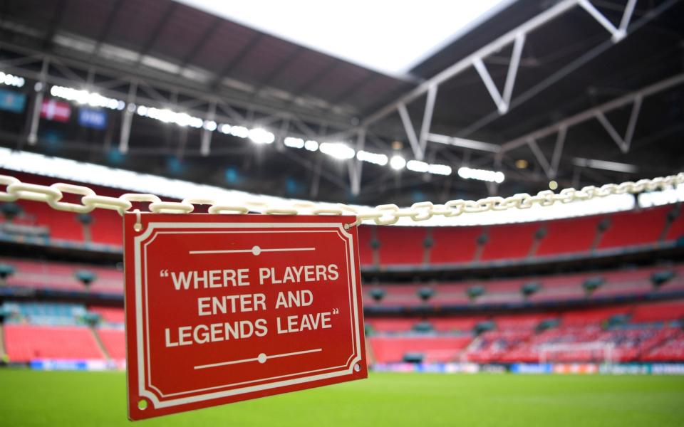  sign saying "Where players enter and legends leave" is seen pitch side inside the stadium prior to the UEFA Euro 2020 Championship Semi-final match between England and Denmark - Shaun Botterill/UEFA via Getty Images