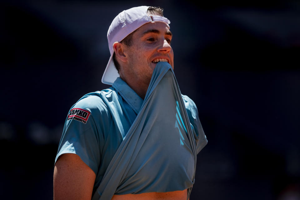 United States' John Isner during a match against Austria's Dominic Thiem at the Mutua Madrid Open tennis tournament in Madrid, Spain, Friday, May 7, 2021. (AP Photo/Bernat Armangue)