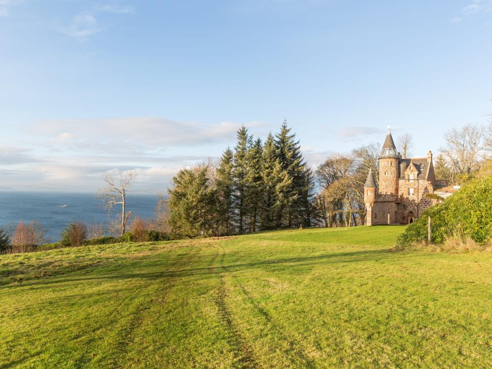 The castle is surrounded by greenery.