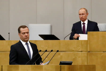 Dmitry Medvedev, who was earlier nominated by Russian President Vladimir Putin as the candidate for the post of Prime Minister, walks before delivering a speech during a session of the State Duma, the lower house of parliament, in Moscow Russia May 8, 2018. REUTERS/Sergei Karpukhin