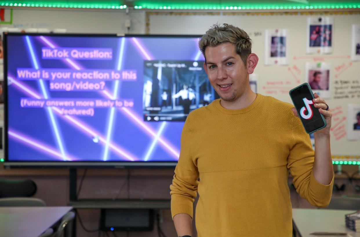 James Workman Middle School teacher Shane Frakes incorporates TikTok videos into his classroom and has a large following on the social media platform.  Here he is in his Cathedral City, Calif., classroom on Feb. 21, 2023. 