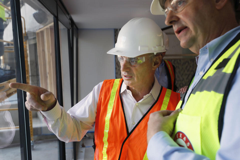 Baseball Commissioner Rob Manfred talks during a tour of the new under construction Texas Rangers stadium in Arlington, Texas, Tuesday, Nov. 19, 2019. Manfred hopes the investigation into sign stealing by the Houston Astros will be completed by next season and says he has broad authority to impose discipline beyond fines, the loss of amateur draft picks and taking away international signing bonus pool allocation. (AP Photo/LM Otero)