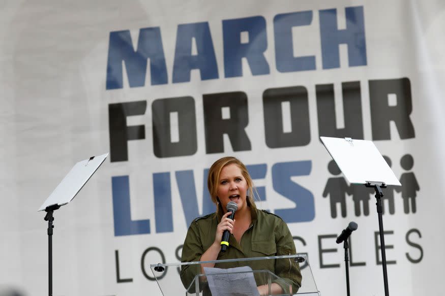 Comedienne Amy Schumer addresses the 50,000-strong crowd in LA: Reuters