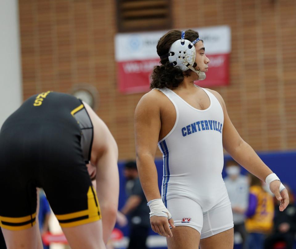Centerville's Leo Calderon and Winchester's Clayton Holder prepare to wrestle in the finals of the Tri-Eastern Conference Tournament Jan. 22, 2022.