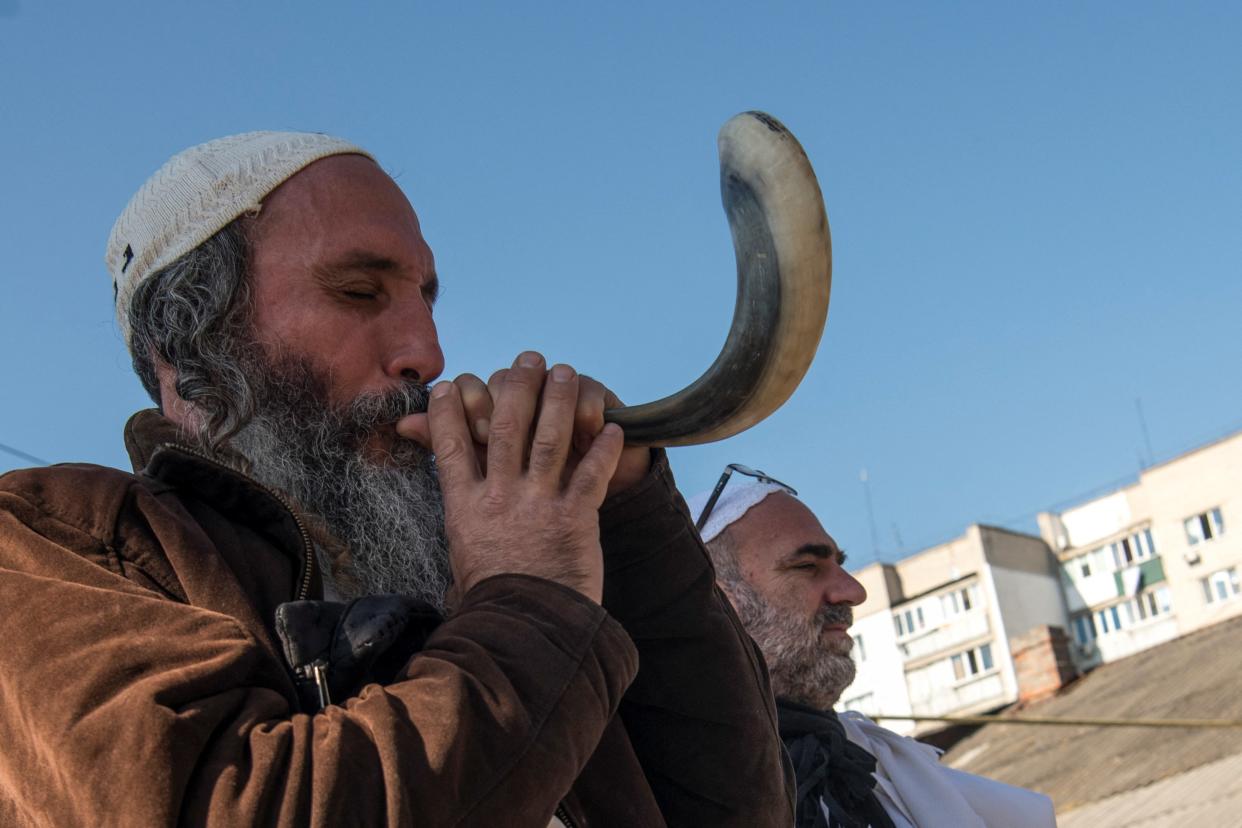 An Ultra-Orthodox Jew blows a shofar during a celebration of the Rosh Hashanah holiday (REUTERS)