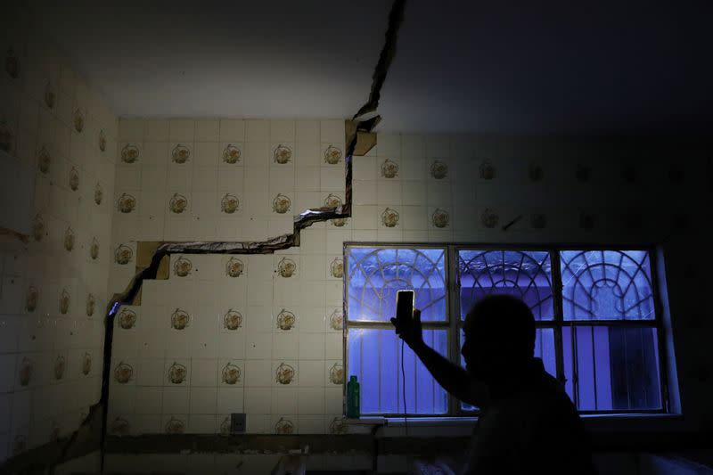Jose Rinaldo Januario shows a damage in his house linked to rock salt mining by the petrochemical company Braskem in Maceio