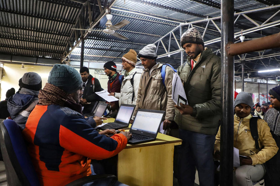 Indian workers submit registration forms seeking employment in Israel during a recruitment drive at the Industrial Training Institute in Lucknow, capital of India's Uttar Pradesh state on January 25, 2024.  (Naeem Ansari / AFP - Getty Images)