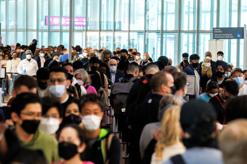 FILE PHOTO: Travellers crowd the departures lounge at Toronto Pearson International Airport in Mississauga