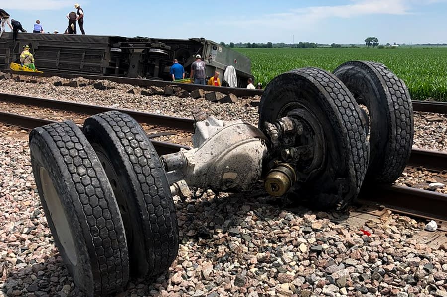 In this photo provided by Dax McDonald, debris sits near railroad tracks after an Amtrak passenger train derailed near Mendon, Mo., on Monday, June 27, 2022. The Southwest Chief, traveling from Los Angeles to Chicago, was carrying about 243 passengers when it collided with a dump truck near Mendon, Amtrak spokeswoman Kimberly Woods said. (Dax McDonald via AP)