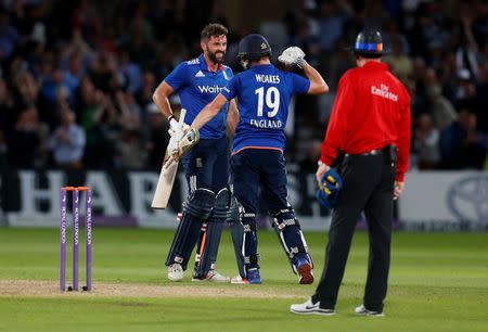 Britain Cricket - England v Sri Lanka - First One Day International - Trent Bridge - 21/6/16 England's Liam Plunkett (L) celebrates with Chris Woakes after hitting a six from the last ball to draw the match Action Images via Reuters / Ed Sykes Livepic