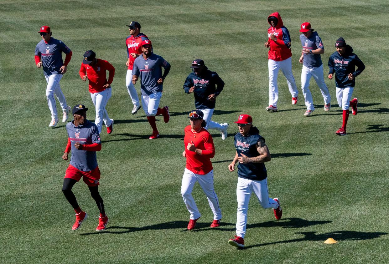 WooSox players warm up before Wednesday's workout at Polar Park.