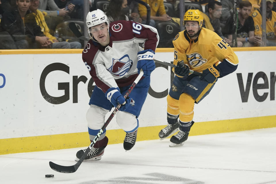 FILE - Colorado Avalanche right wing Nicolas Aube-Kubel (16) moves the puck ahead of Nashville Predators' Alexandre Carrier (45) during the first period in Game 4 of an NHL hockey first-round playoff series Monday, May 9, 2022, in Nashville, Tenn. The Stanley Cup champion Colorado Avalanche have told forward Nicolas Aube-Kubel he will not receive a qualifying offer and will become a free agent when the market opens Wednesday, July 13, according to a person with knowledge of the decision. (AP Photo/Mark Humphrey, File)