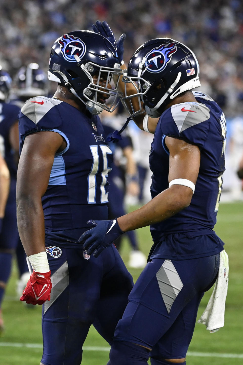 Tennessee Titans wide receiver Robert Woods (2) celebrates his touchdown with Treylon Burks (16) during the second half of an NFL football game against the Dallas Cowboys, Thursday, Dec. 29, 2022, in Nashville, Tenn. (AP Photo/Mark Zaleski)