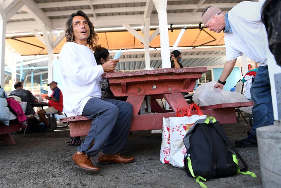 Peter Rulas eats a meal at Mary's Kitchen in Orange on Thursday morning.