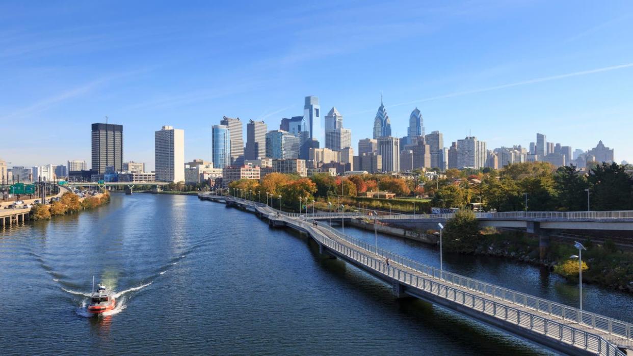 <div>Boat in front of Philadelphia Skyline with Schuylkill River Park Boardwalk, Philadelphia, Pennsylvania. (Photo by: Jumping Rocks/Universal Images Group via Getty Images)</div>