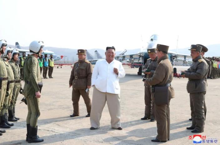 This undated picture released from North Korea's official Korean Central News Agency on April 12, 2020, shows North Korean leader Kim Jong Un inspecting military aircraft (AFP Photo/STR)