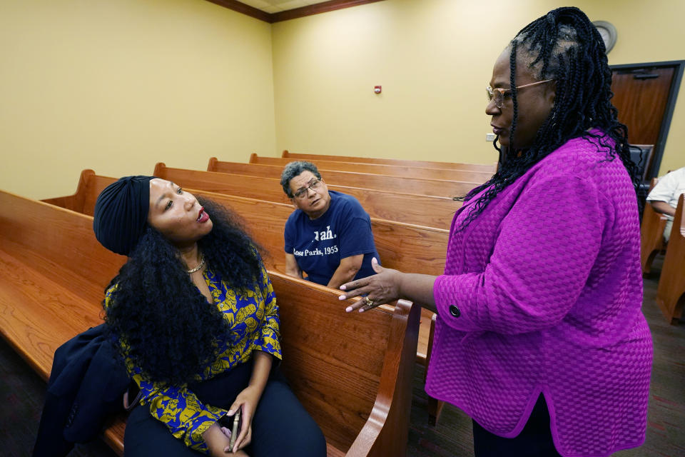 Jill Collen Jefferson, president of JULIAN, a civil rights and international human rights law firm, left, and Bonita Streeter, a bail bondsman and community activist, center, confer with Mitzi Dease Paige, an Assistant U.S. Attorney with the Southern District of Mississippi, right, prior to interacting Justice Department's Civil Rights Division during the Lexington, Miss., stop on the division's civil rights tour, Thursday, June 1, 2023. (AP Photo/Rogelio V. Solis)