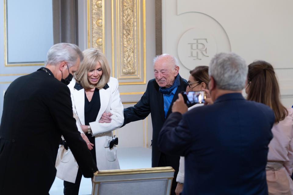 Brigitte Macron and Edgar Morin (R) attend a ceremony to celebrate Morin’s 100th birthday at Elysee Palace in Paris. - Credit: Jacques Witt/SIPA