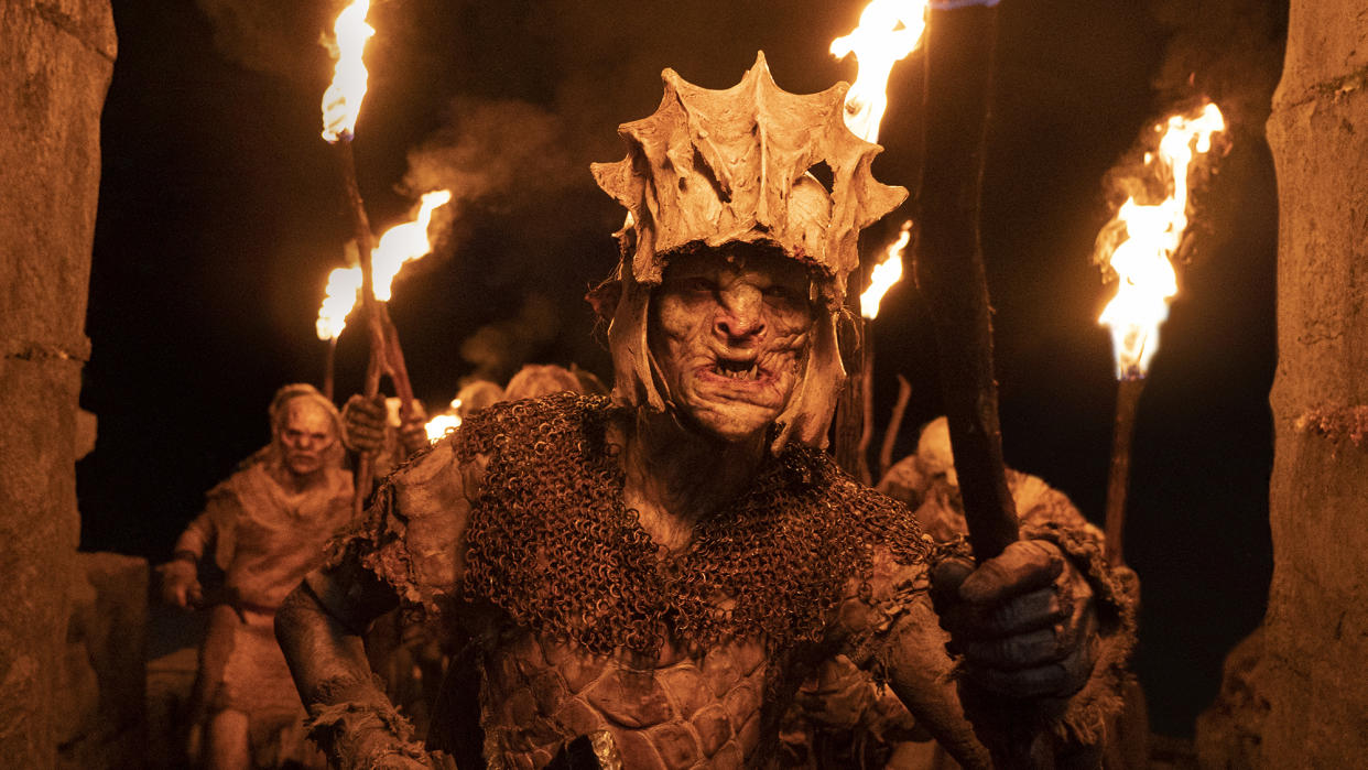  Orcs, carrying torches, as depicted in The Lord of the Rings: The Rings of Power 