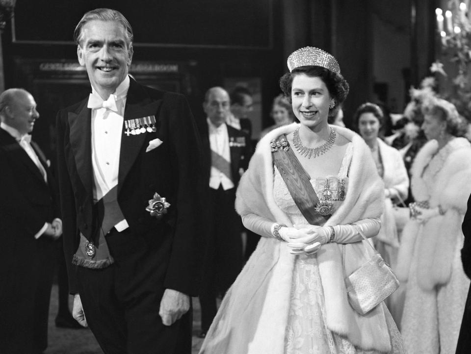 Antony Eden and Queen Elizabeth dressed in a gown at a party