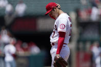 Los Angeles Angels starting pitcher Shohei Ohtani rubs his neck before pitching during the first inning of a baseball game against the San Francisco Giants Wednesday, June 23, 2021, in Anaheim, Calif. (AP Photo/Mark J. Terrill)