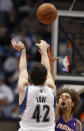 Minnesota Timberwolves forward Kevin Love (42) scores over Phoenix Suns center Robin Lopez during the third quarter of an NBA basketball game Monday, April 9, 2012, in Minneapolis. The Suns defeated the Timberwolves 114-90. (AP Photo/Genevieve Ross)