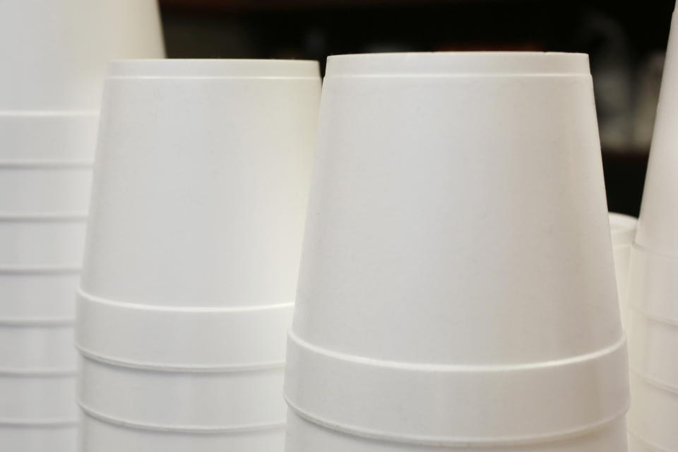 FILE - In this Feb. 14, 2013 file photo, polystyrene foam soup containers are stacked in a New York restaurant. Maine is banning single-use food and drink containers made from polystyrene foam. Democratic Gov. Janet Mills signed the bill into law Tuesday, April 30, 2019; environmental advocates say that makes Maine the first state to ban disposable foam food containers. Supporters say the law, which goes into effect Jan. 1, 2021, will reduce litter in the state's lakes, rivers and coastal waters. (AP Photo/Mark Lennihan, File)
