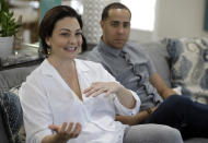 NBA referees Lauren Holtkamp-Sterling, left, gestures as she sits with her husband Jonathan Sterling, the only married couple in NBA refereeing history, during an interview at their home Thursday, Oct. 3, 2019, in Tampa, Fla. (AP Photo/Chris O'Meara)