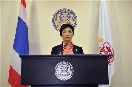 Thai Prime Minister Yingluck Shinawatra reacts during a news conference at police headquarters in Bangkok December 9, 2013. REUTERS/Stringer