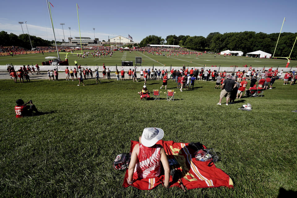 People watch Kansas City Chiefs workouts at NFL football training camp Saturday, July 30, 2022, in St. Joseph, Mo. (AP Photo/Charlie Riedel)