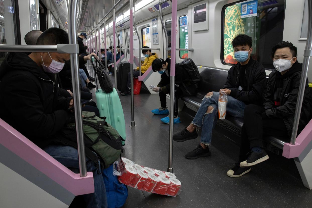 Passengers take the subway line in Wuhan in central China's Hubei province on Wednesday, April 1, 2020. Life in China post-coronavirus outbreak is ruled by a green symbol on a smartphone screen. Green signifies the "health code" that says the user is symptom-free. It is required to board a subway, check into a hotel or enter Wuhan, the city where the global pandemic began.