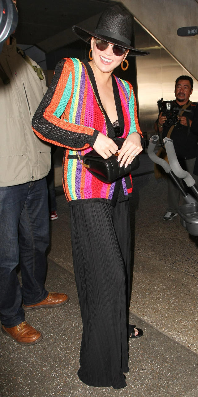 Diane Kruger carries her chic Louis Vuitton bag while arriving for a  departing flight at LAX Airport on Wednesday (Dece…