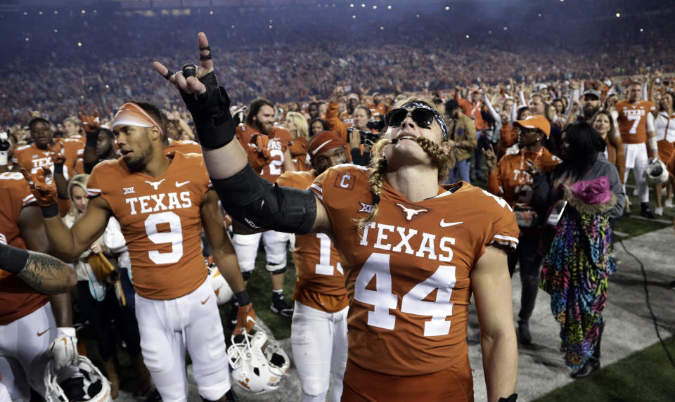 Texas defensive lineman Breckyn Hager (44) celebrates the team’s win over Iowa State with teammates in an NCAA college football game, Saturday, Nov. 17, 2018, in Austin, Texas. (AP Photo/Eric Gay)