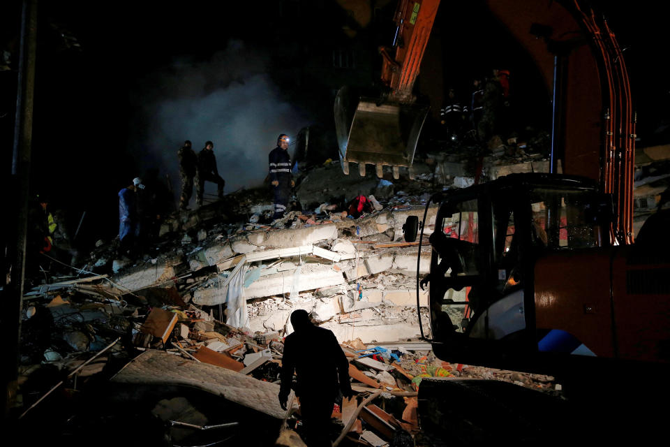 A rescue team works on a collapsed building following an earthquake in Osmaniye, Turkey, on Feb. 6.<span class="copyright">Dilara Senkaya—Reuters</span>