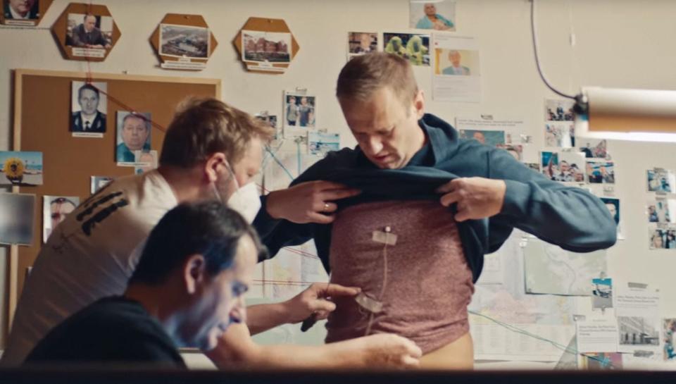 Alexei Navalny is miked up to secretly record a conversation with his suspected poisoner in 'Navalny.' Christo Grosev is in foreground.