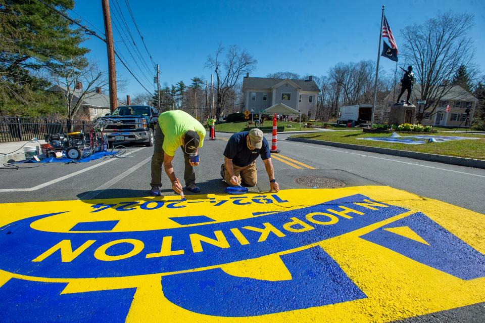 Pete Thibeault and Matt Tobin, both of Pioneer Turf Surfaces, paint the start line on East Main Street (Route 135) in Hopkinton for the 128th running of the Boston Marathon, April 9, 2024. East Main Street in Hopkinton will be closed to motorists at 7:15 a.m. on Marathon Monday.
