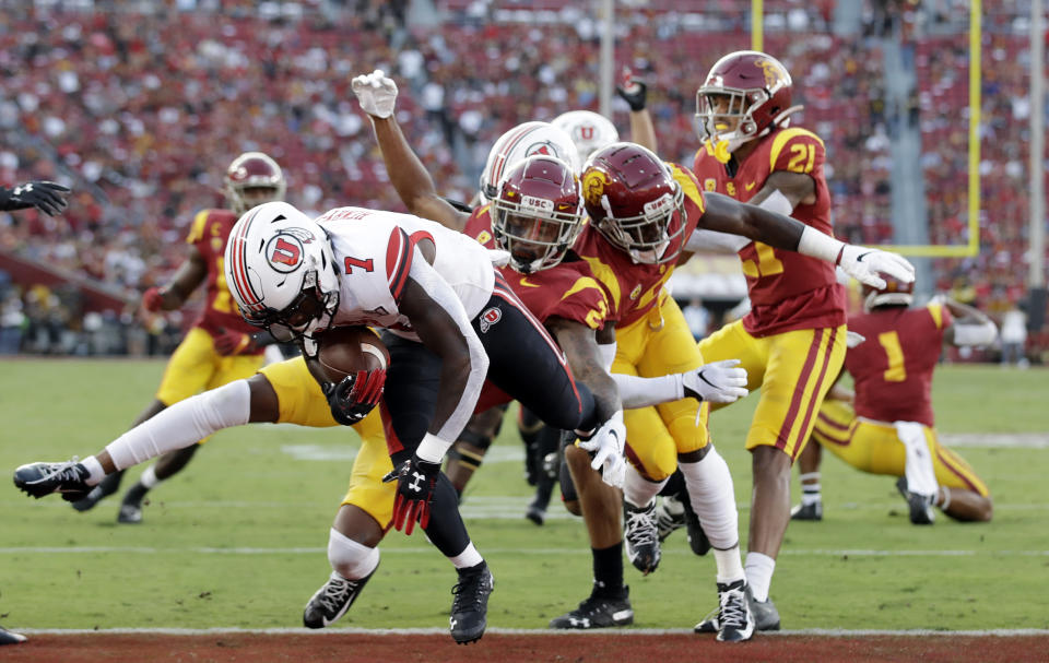 Utah running back Devonta'e Henry-Cole (7) runs in for a touchdown against Southern California during the first half of an NCAA college football game Friday, Sept. 20, 2019, in Los Angeles. (AP Photo/Marcio Jose Sanchez)