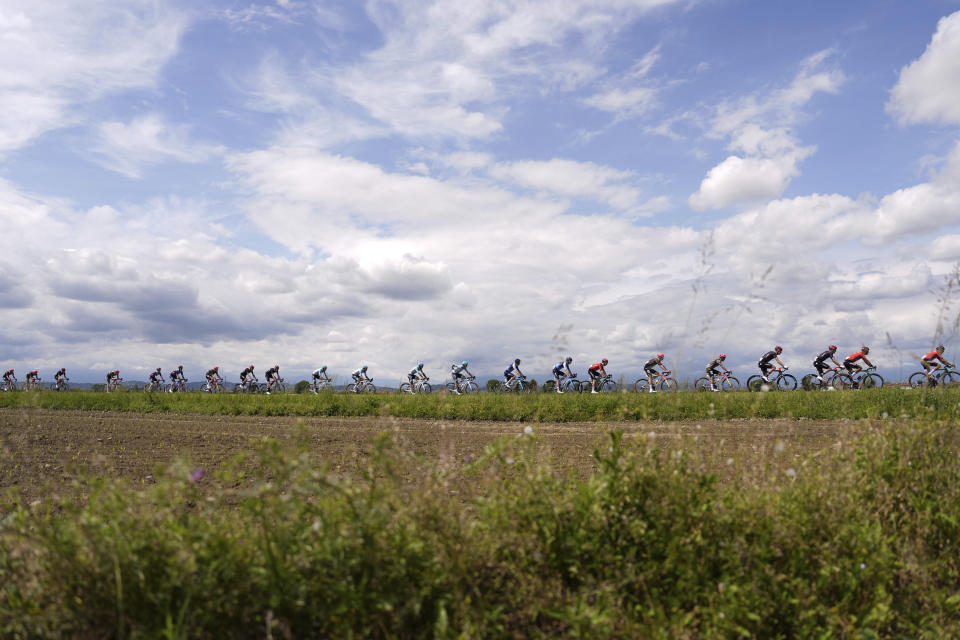The pack rides during stage 2 of the Giro d'Italia from San Francesco al Campo to Santuario di Oropa, Italy, Sunday, May 5, 2024. (Fabio Ferrari/LaPresse via AP)