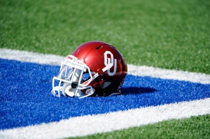 Oct 19, 2013; Lawrence, KS, USA; An Oklahoma Sooners helmet sits on the field before the game against the Kansas Jayhawks at Memorial Stadium. Oklahoma won the game 34-19. (John Rieger-USA TODAY Sports)