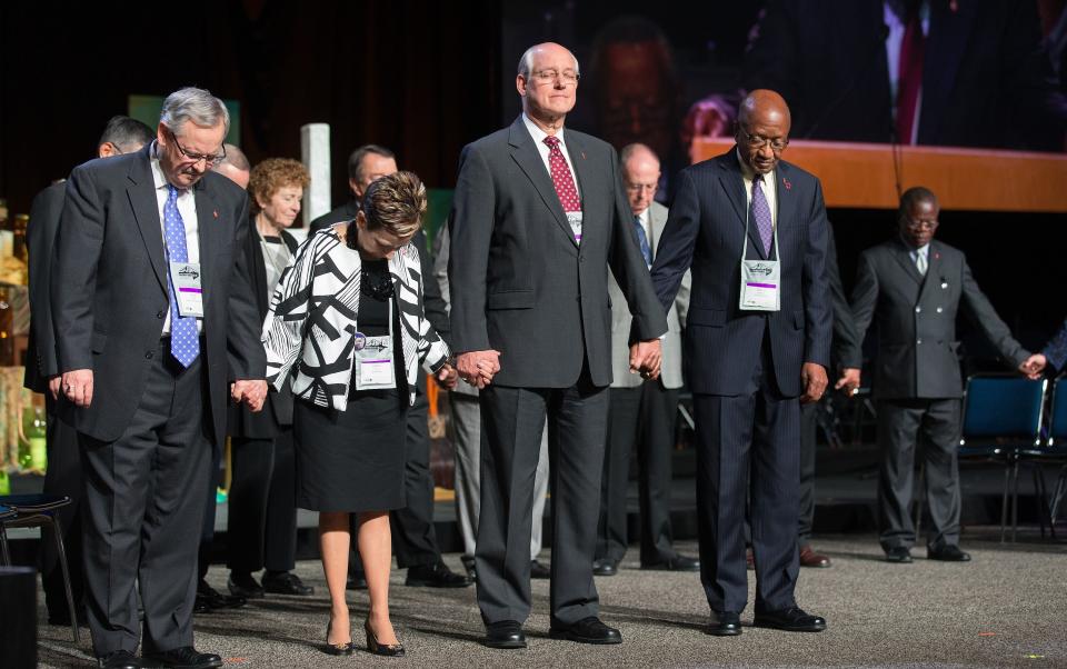 United Methodist bishops pray at the UMC General Conference in 2016 in Portland, Oregon, which was the last time the denomination's top legislative assembly convened for a regular session. The general conference is set to gather in Charlotte starting April 22, 2024.