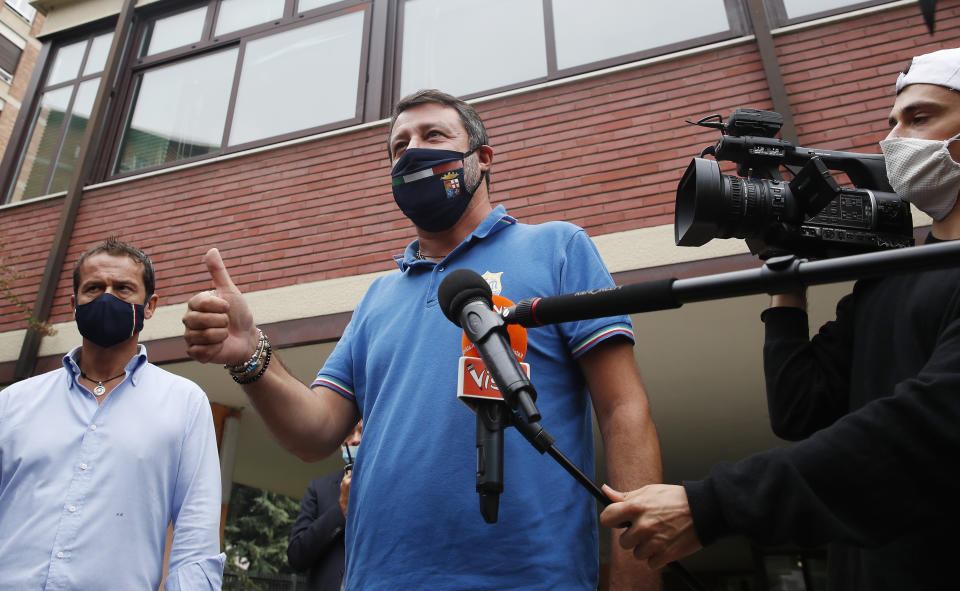 Right-wing opposition leader Matteo Salvini leaves a polling station, in Milan, Italy, Monday, Sept. 21, 2020. On Sunday and Monday Italians are called to vote nationwide in a referendum to confirm a historical change to the country's constitution to drastically reduce the number of Members of Parliament from 945 to 600. Eighteen million of Italian citizens will also vote on Sunday and Monday to renew local governors in seven regions, along with mayors in approximately 1,000 cities. (AP Photo/Antonio Calanni)