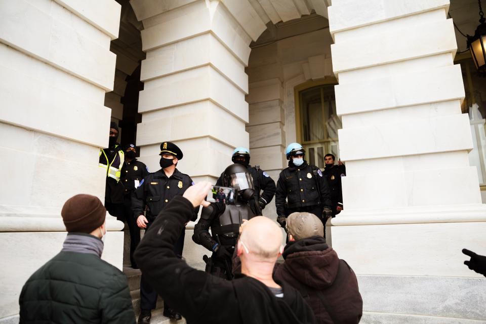 A group of pro-Trump protesters face-off against Capitol policeGetty Images