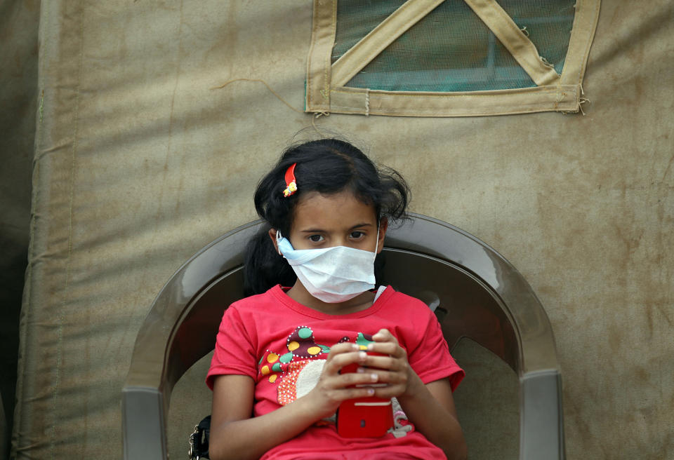 A Yemeni child sits outside a makeshift hospital in Sanaa on June 5, 2017. (Photo: AFP/Getty Images)