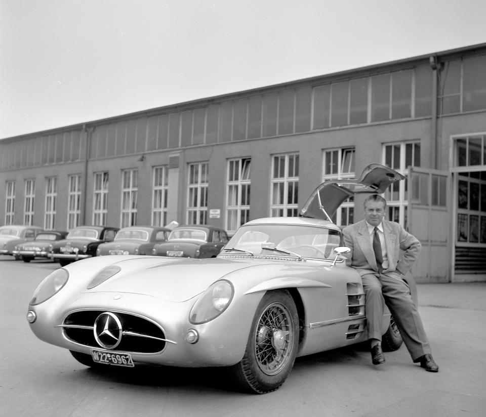 The picture shows one of the two 300 SLR Uhlenhaut Coupe’s together with the inventor Rudolph Uhlenhaut.  This vehicle is on display in the Mercedes-Benz Museum. 