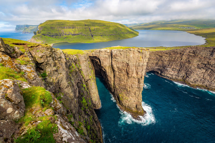 lake above a mountain below the ocean