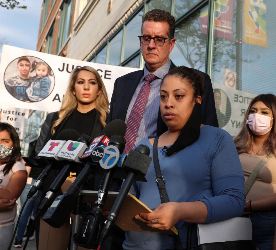 Veronica Alvarez, foreground, the mother of 22-year-old Anthony Alvarez, reads a statement to the media on Tuesday, April 27, 2021, after watching video of her son's fatal shooting.