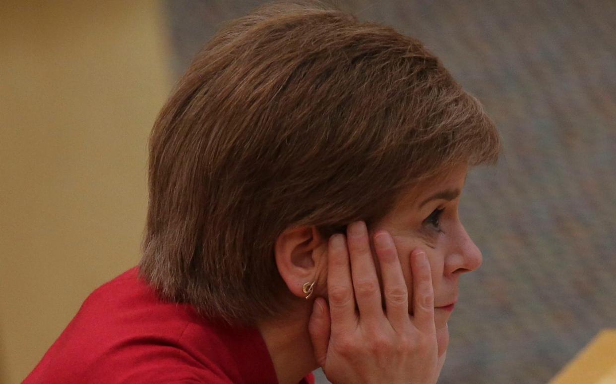 EDINBURGH, SCOTLAND - FEBRUARY 23: Scottish First Minister Nicola Sturgeon reacts as she makes a statement on the coronavirus disease (COVID-19) restrictions at the Scottish Parliament on February 23, 2021 in Edinburgh, Scotland. The First Minister set out the country's plans for a gradual easing of the current lockdown restrictions, with the eventual return to the â€œlevelsâ€ system for different areas of Scotland.  - Bremner/Getty Images