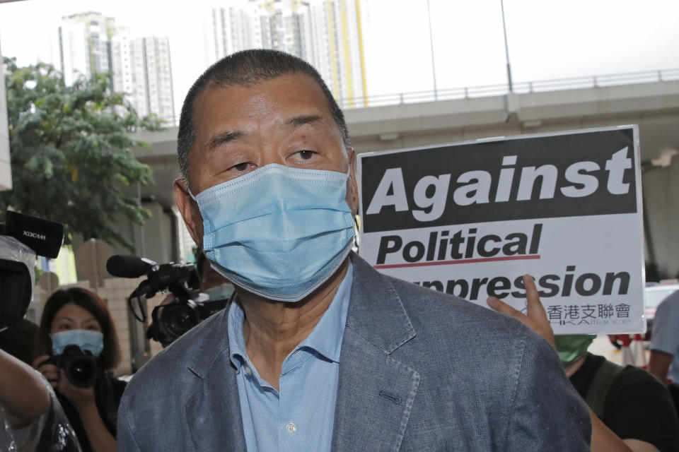 FILE - Jimmy Lai, among various of groups of pro-democracy activists, arrives at a court in Hong Kong on Sept. 15, 2020. Apple Daily's founder, Jimmy Lai, was convicted of fraud last year that his supporters said were politically motivated. China was the biggest global jailer of journalists last year with more than 100 behind bars, according to a press freedom group, as President Xi Jinping's government tightened control over society. (AP Photo/Kin Cheung, File)