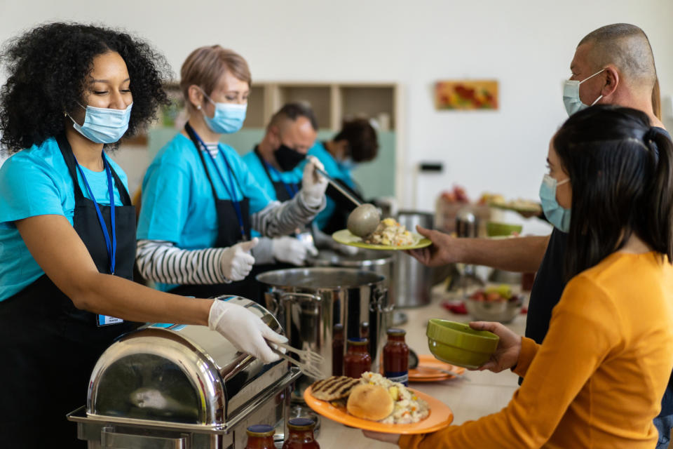 Volunteers serving food